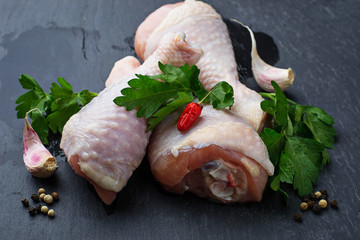 Raw chicken legs with parsley