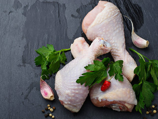 Raw chicken legs with parsley