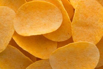Close up potato chips on wood top view background.