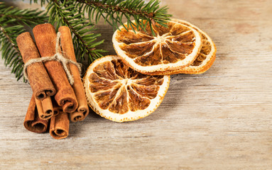 Dried orange slices, cinnamon sticks, branch of spruce
