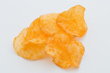 Crisps with paprica on a white background.