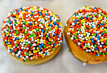 Fototapeta na wymiar Fresh donuts for Hanukkah celebration. Selective focus.