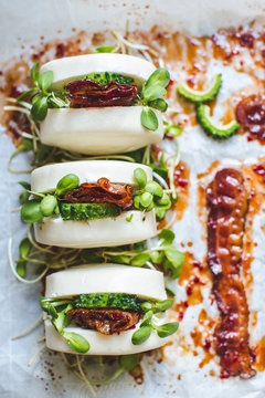 Steamed bread buns with bacon and pickled melon