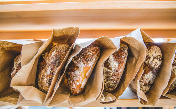 Whole Loaves In Brown Paper Bags 