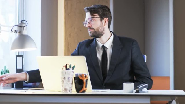Young Businessman Having a Break at Work