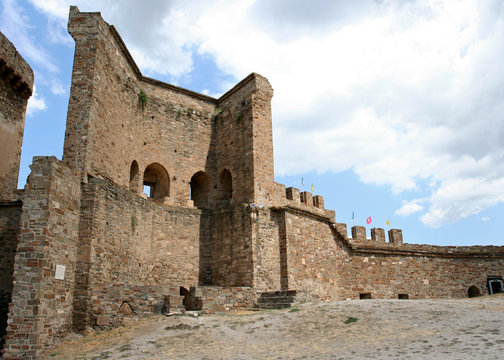 The reconstructed stony wall and the fragment of the tower in the medieval Genoese fortress Soldaia in Sudak, Crimea.   