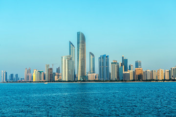 Naklejka premium Abu Dhabi Skyline at sunset, United Arab Emirates