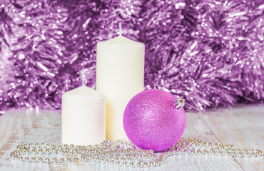Lilac Christmas ball, two white candles and silver beads