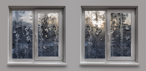 Fototapeta premium Two windows with an icy frosty pattern on the glass