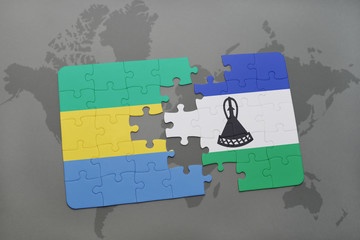 puzzle with the national flag of gabon and lesotho on a world map
