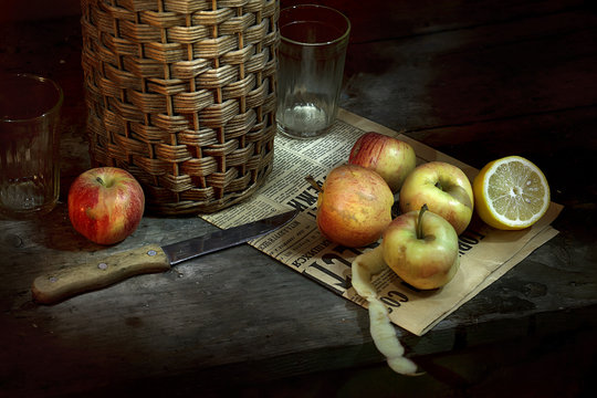 Vintage still life Mediterranean. Wine, apples, lemon on the table