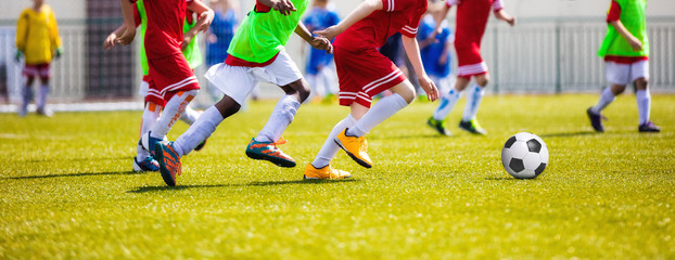 Running Young Soccer Football Players. Footballers Kicking Football Match Game. Youth Soccer...