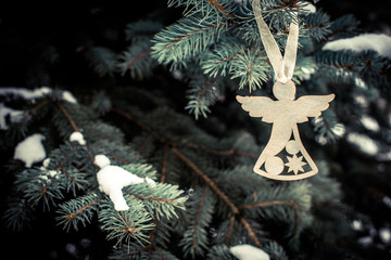 Christmas background Silver Angel in the branches of fir 