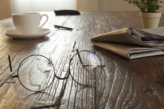 newspaper over wooden table