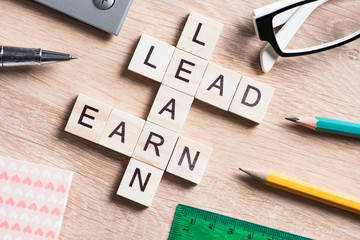 Conceptual business keywords on table with elements of game making crossword