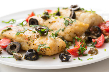 Filetti di merluzzo alla mediterranea, boiled cod fillets with black olives, capers and tomatoes
