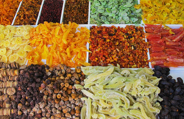 Variety of dried fruit: raisin, dates, figs, lemons, pineapples, apples, pears, nuts, apricots, market of Madeira 