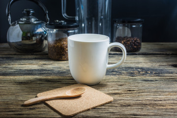 Focus spot, Cup of hot coffee on the old wooden table. In the morning coffee in the kitchen. Welcome the new day.