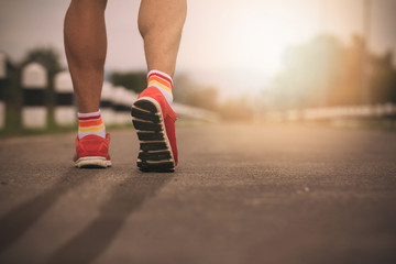 Closeup Runner feet running on road,Vintage Effect