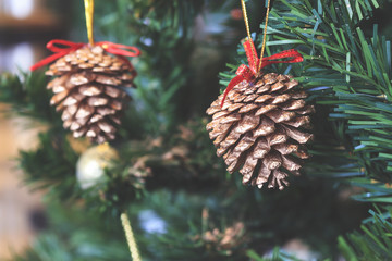 christmas colorful decoration closeup image with old film colors tone in soft-focus in the background. over light