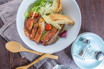 salad with salmon and chicken and bread