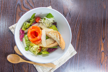 salad with salmon and chicken and bread