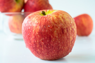 Red apples on white back ground.
