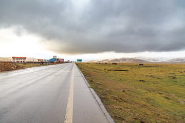 prairie road with storm