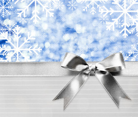 Festive ribbon bow on bright creative background © Africa Studio