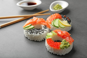 Sushi doughnuts on grey textured background