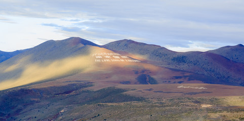 Fototapeta premium sunshine on the mountain,the chinese words meaning kangding city