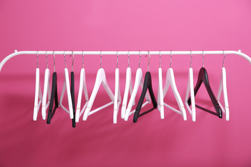 Modern hangers on pink wall background