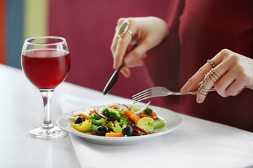 Close up view of woman having lunch at restaurant