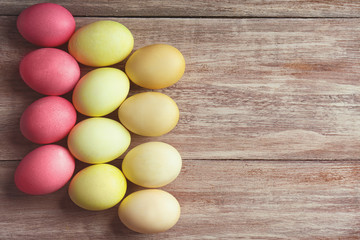 Colorful Easter eggs on wooden table
