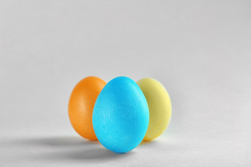 Colorful Easter eggs on light background