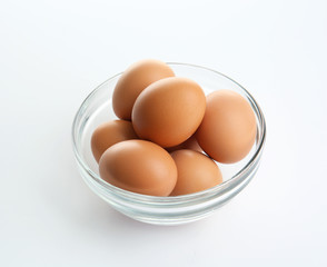Bowl of eggs isolated on white