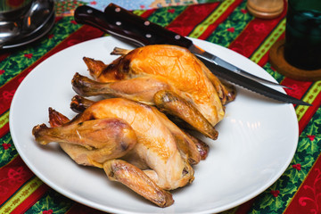 Roasted chickens on a Christmas dining table.