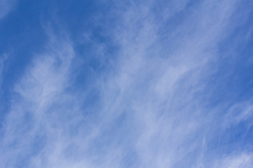 blue sky with tiny clouds