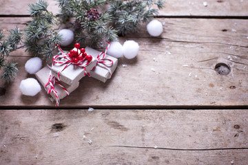 Wrapped boxes with  presents  and fur tree branches  on vintage