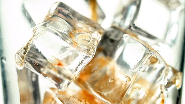 Macro Soda Poured Over Ice on White Background