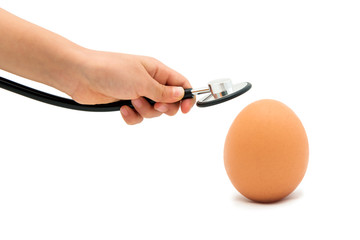 Checking For A Healthy Egg, Egg with Stethoscope with white background