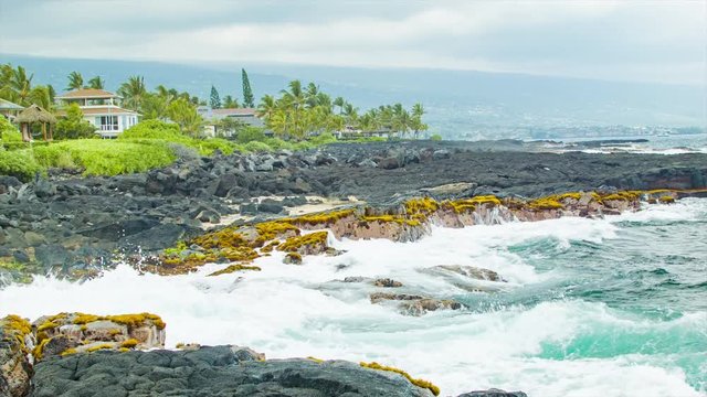 Pacific Ocean White Water Splashing onto Textured Lava Rock on the Shore of Kailua Kona Hawaii
