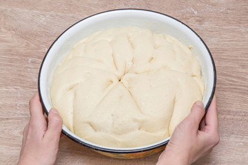 Dough in the bowl is ready for baking. Homemade pastries for Christmas time in the kitchen. Healthy eating lifestyle.