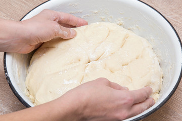 Dough in the bowl is ready for baking. Homemade pastries for Christmas time in the kitchen. Healthy eating lifestyle.