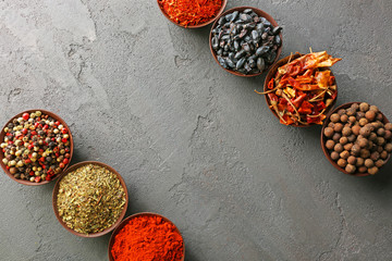 Different spices in bowls on table