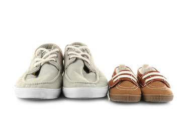 Family concept. Shoes for father and son on white background