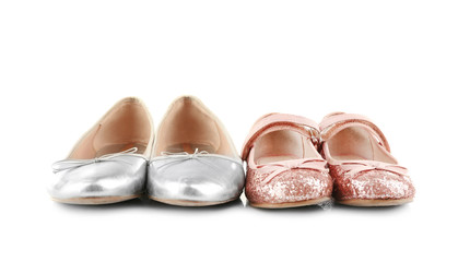 Family concept. Shoes for mother and daughter on white background