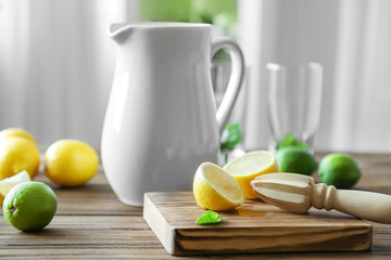 Jug with lemonade on wooden kitchen  table