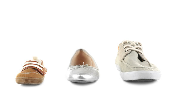 Family concept. Shoes for parents and child on white background