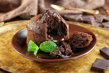 Chocolate fondant with mint on tray